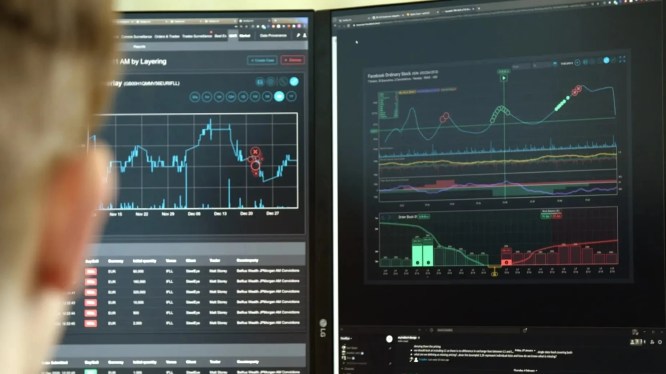 man staring at monitors